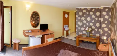 a hotel room with a desk and a computer in it at Guest House Ianis Paradise in Nesebar