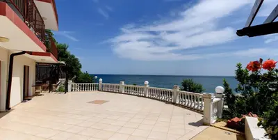 a balcony of a house with a view of the ocean at Guest House Ianis Paradise in Nesebar