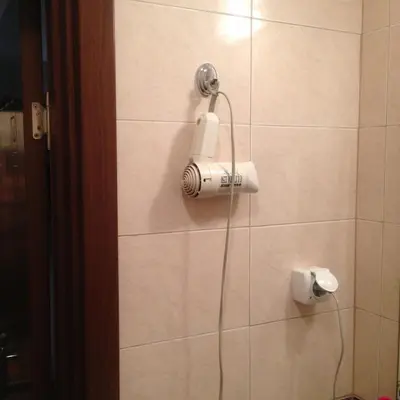 a shower head on a wall in a bathroom at Квартира у моря in Pomorie