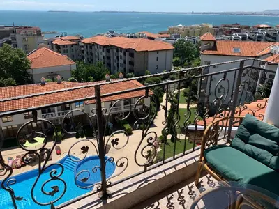 a balcony with a view of a city at Triumph Holiday Village in Sveti Vlas