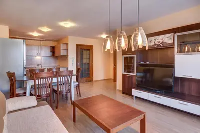 a kitchen and living room with a dining room at ДриймБг Апартаменти - Панорама Бийч, Несебър in Nesebar