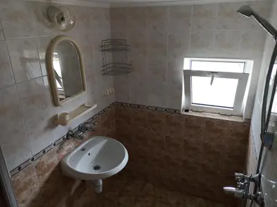 a bathroom with a sink and a mirror at Anele,Kiten in Kiten
