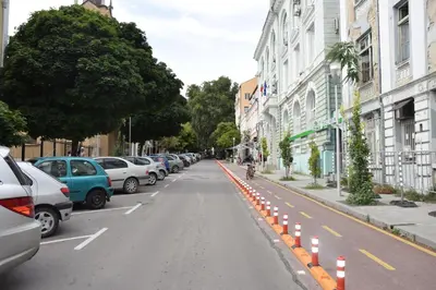 a street with cars parked on the side of the road at Нестандартно Бутиково студио за двама Романтика in Varna City