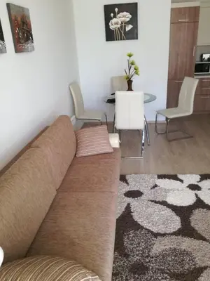 a living room with a couch and a table at Apartament Nora01 in Burgas City