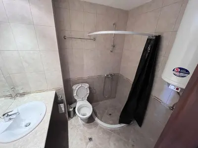 a bathroom with a shower and a toilet and a sink at Julia Vigo Panorama apartments in Nesebar