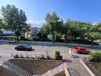 a couple of cars parked in a parking lot at Julia Vigo Panorama apartments in Nesebar