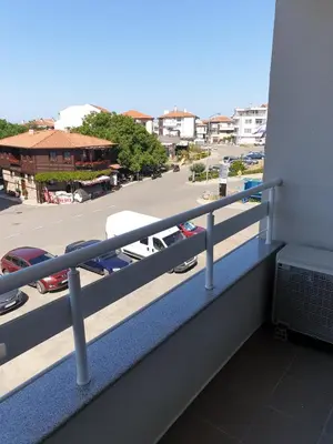 a balcony with a view of a parking lot at Апартаменти Кастро/Castro Apartments in Tsarevo