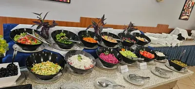 a table with many bowls of different types of food at Hotel Liani - All Inclusive in Sunny Beach