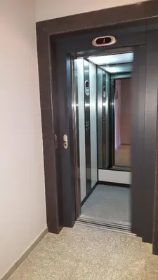 a hallway with a mirror in a building at Iva Resort in Byala