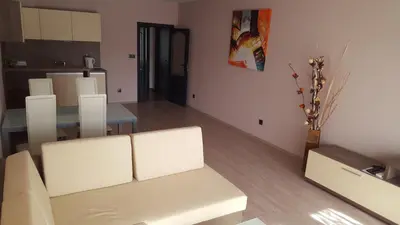 a living room with a white couch and a table at Iva Resort in Byala