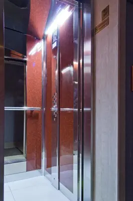 a elevator in a building with a light on it at Family Hotel Paros in Pomorie
