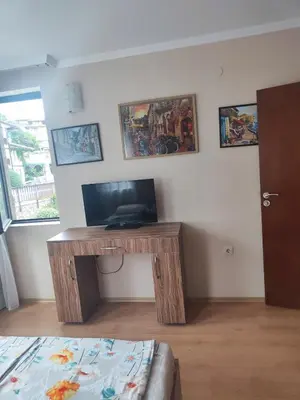 a room with a desk with a computer on it at Jacky's Apartament - Апартамент в Свети Влас in Sveti Vlas