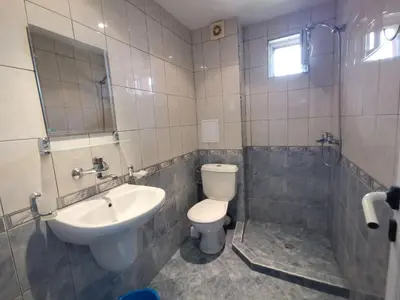 a bathroom with a toilet and a sink at Guest House Georgieva Ravda in Ravda
