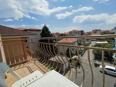a balcony with a view of a city at Guest House Georgieva Ravda in Ravda