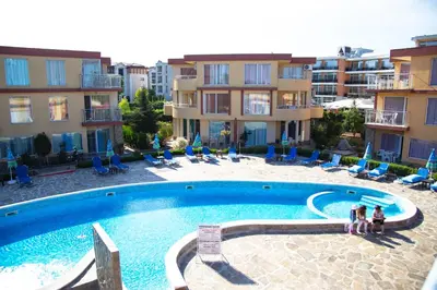 a large swimming pool in front of some buildings at Mappy Holidays Aparthotel in Sozopol