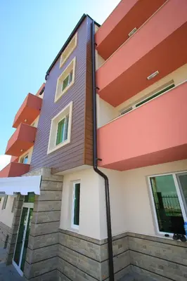 a facade of a building with a house at Siena House in Sozopol