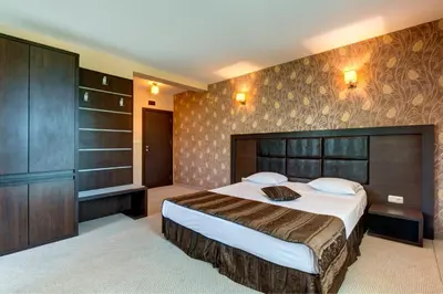 a bedroom with a large bed in a room at Siena House in Sozopol