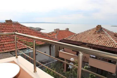 a view of the water from the balcony of a building at Family Hotel Emilia in Sozopol