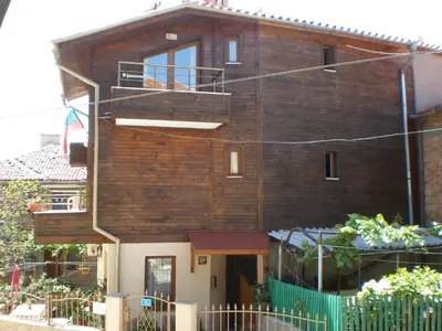 a brick house with a staircase in front of it at Family Hotel Emilia in Sozopol