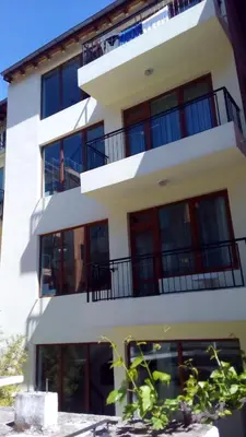 a building with balconies on the side of it at Guest House Diamant in Sozopol