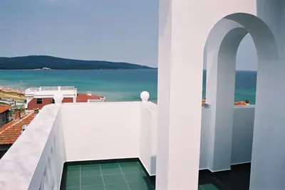 a view of the ocean from the balcony of a building at Hotel Levteri in Primorsko