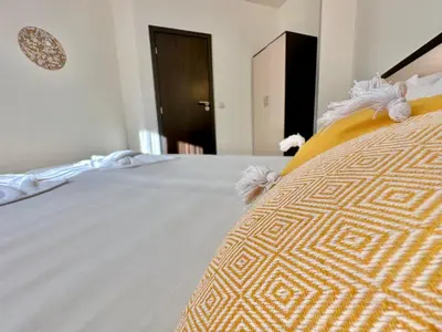 a close up of a bed in a bedroom at Menada Imperial Heights Villas in Sunny Beach