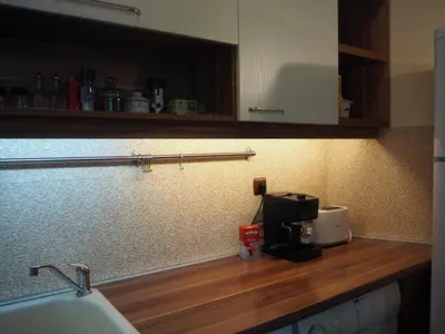 a kitchen counter top with a coffee maker on it at Yoana Apartment in Varna City