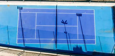 a tennis court is painted on a blue wall at Villa EM in Lozenets