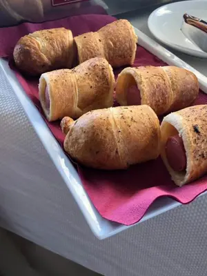 a tray with hot dogs in buns on a table at Villa EM in Lozenets