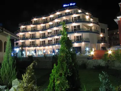 a large building with lights on it at night at Blue Bay Hotel in Sunny Beach