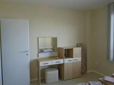 a room with a mirror and a dresser in a room at Nedev's Apartments in Kavatsi Area in Sozopol