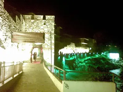 a building with christmas lights on it at night at Nedev's Apartments in Kavatsi Area in Sozopol
