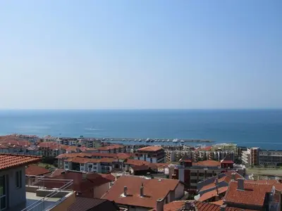 a view of a city with buildings and the ocean at House Sofia in Sveti Vlas