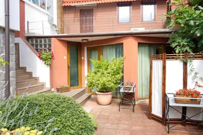 a courtyard of a house with potted plants at House Prodanovi in Sozopol