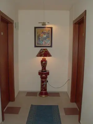 a lamp sitting on the floor in a room at Hotel Evridika in Nesebar