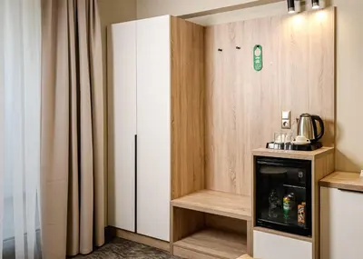 a kitchen with a refrigerator and a cupboard at Hotel Laguna Park Sunrise in Sunny Beach