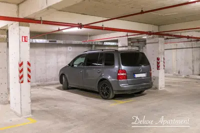 a silver van parked in a parking garage at Apartment Cathedral Deluxe in Varna City