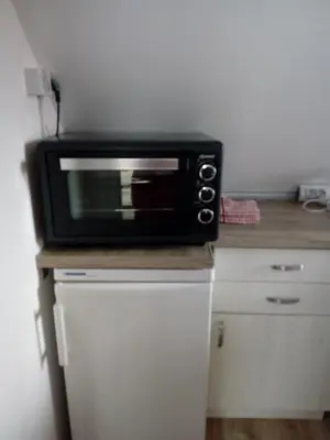 a microwave sitting on top of a counter at Studio Lilou in Varna City