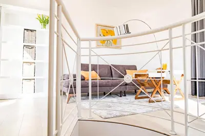 a living room with a couch and a table at KApartments in Varna City