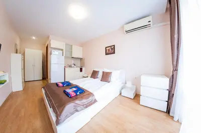 a bedroom with a large white bed in a room at Prestige Fort Beach - Full Board in Sveti Vlas