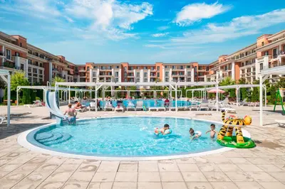 a group of people playing in a pool at a resort at Prestige Fort Beach - Full Board in Sveti Vlas