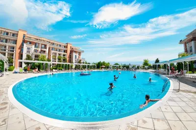 a group of people swimming in a swimming pool at Prestige Fort Beach - Full Board in Sveti Vlas