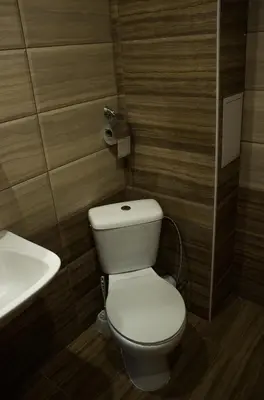 a bathroom with a toilet and a sink at Family Hotel Saint Iliya in Burgas City