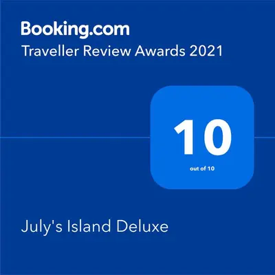 a blue phone with the number on it at July's Island Deluxe in Chernomorets