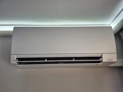 a silver microwave oven hanging from a ceiling at Park and pool Studio Apostolovi in Nesebar