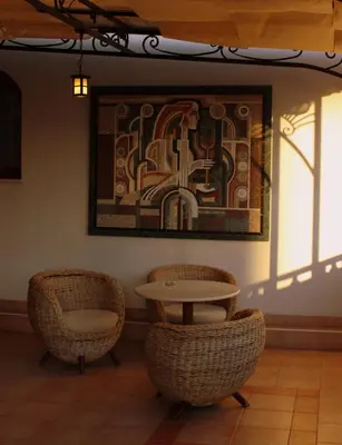 two chairs and a table in a room with a painting at Helena Park - Ultra All Inclusive in Sunny Beach
