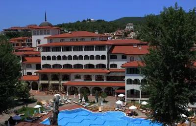 a hotel with a swimming pool in front of a building at Helena Park - Ultra All Inclusive in Sunny Beach