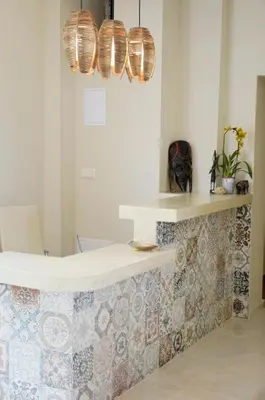 a bathroom with a tub with a tiled counter at Ashram Hotel in Primorsko