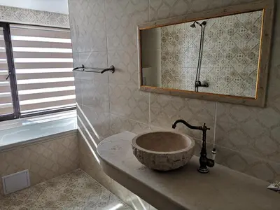 a bathroom with a sink and a mirror at Ashram Hotel in Primorsko