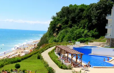 a resort with a beach and a swimming pool at Апартаменти Бяла Клиф на плажа - Apartments Byala Cliff First Line in Byala